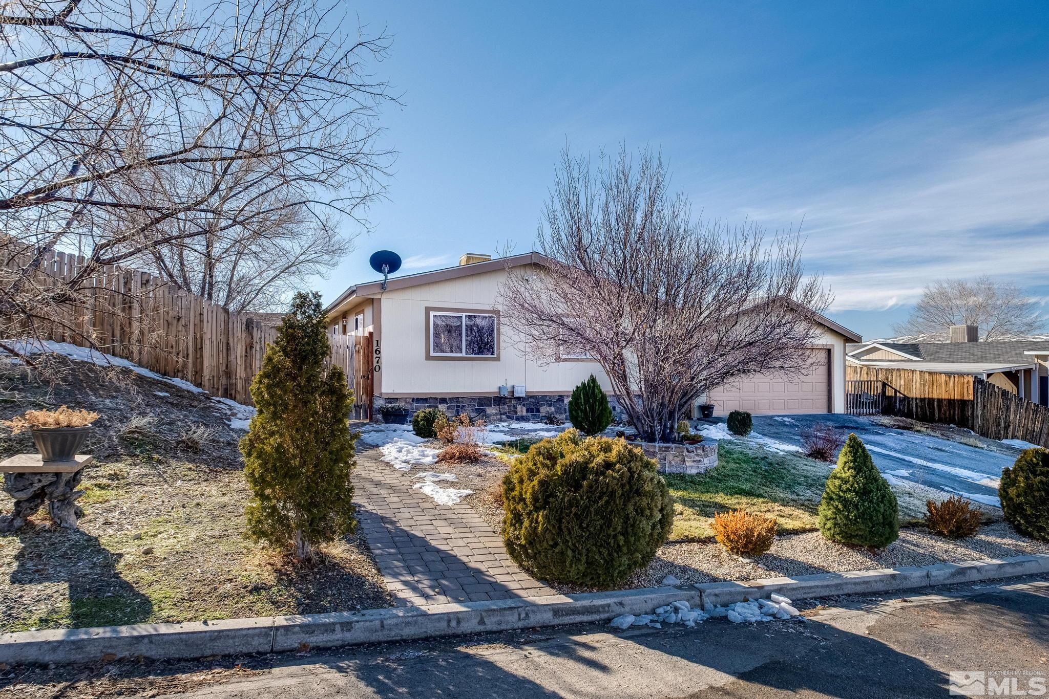 1670 Rockchuck Road Reno, NV 89506 - Photo 24 of 31 a front view of a house with garden