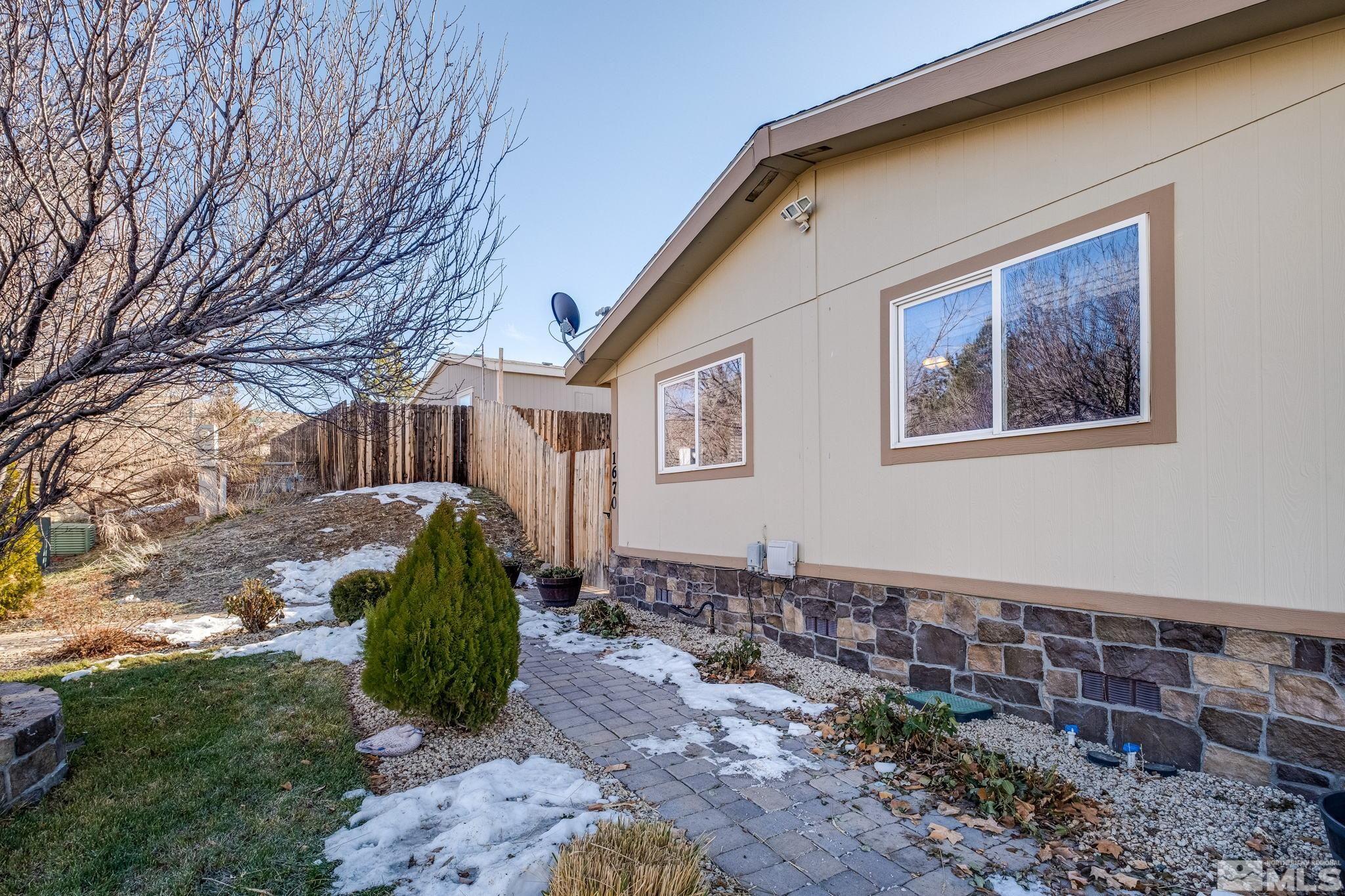 1670 Rockchuck Road Reno, NV 89506 - Photo 26 of 31 a front view of a house with garden