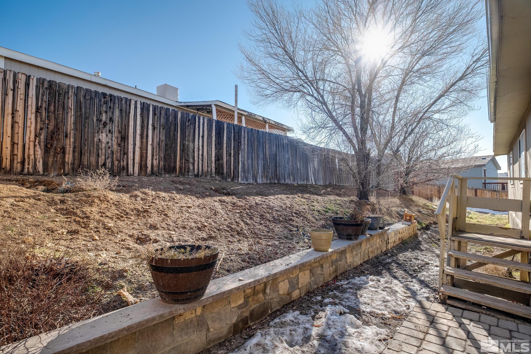 1670 Rockchuck Road Reno, NV 89506 - Photo 27 of 31 a view of a backyard with plants and trees