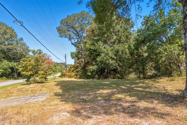 a view of dirt yard with a small yard