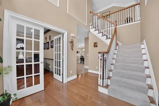a view of entryway with stairs and wooden floor