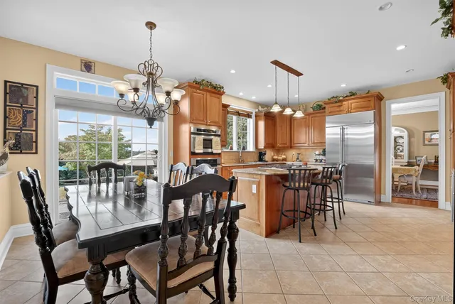 a view of a dining room with furniture window and outside view