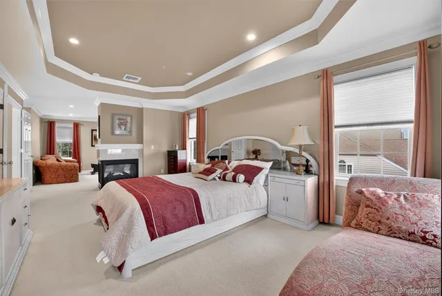 a bedroom with a large bed and a tv