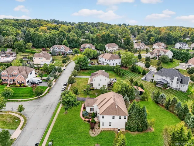 an aerial view of a house with outdoor space and street view