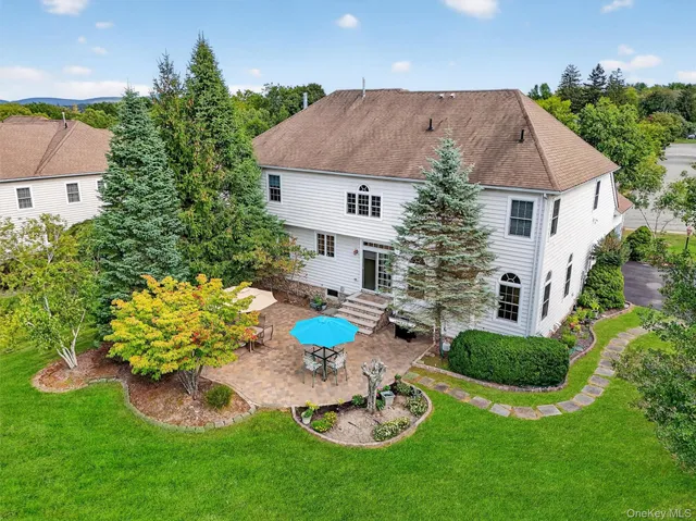 a aerial view of a house with table and chairs