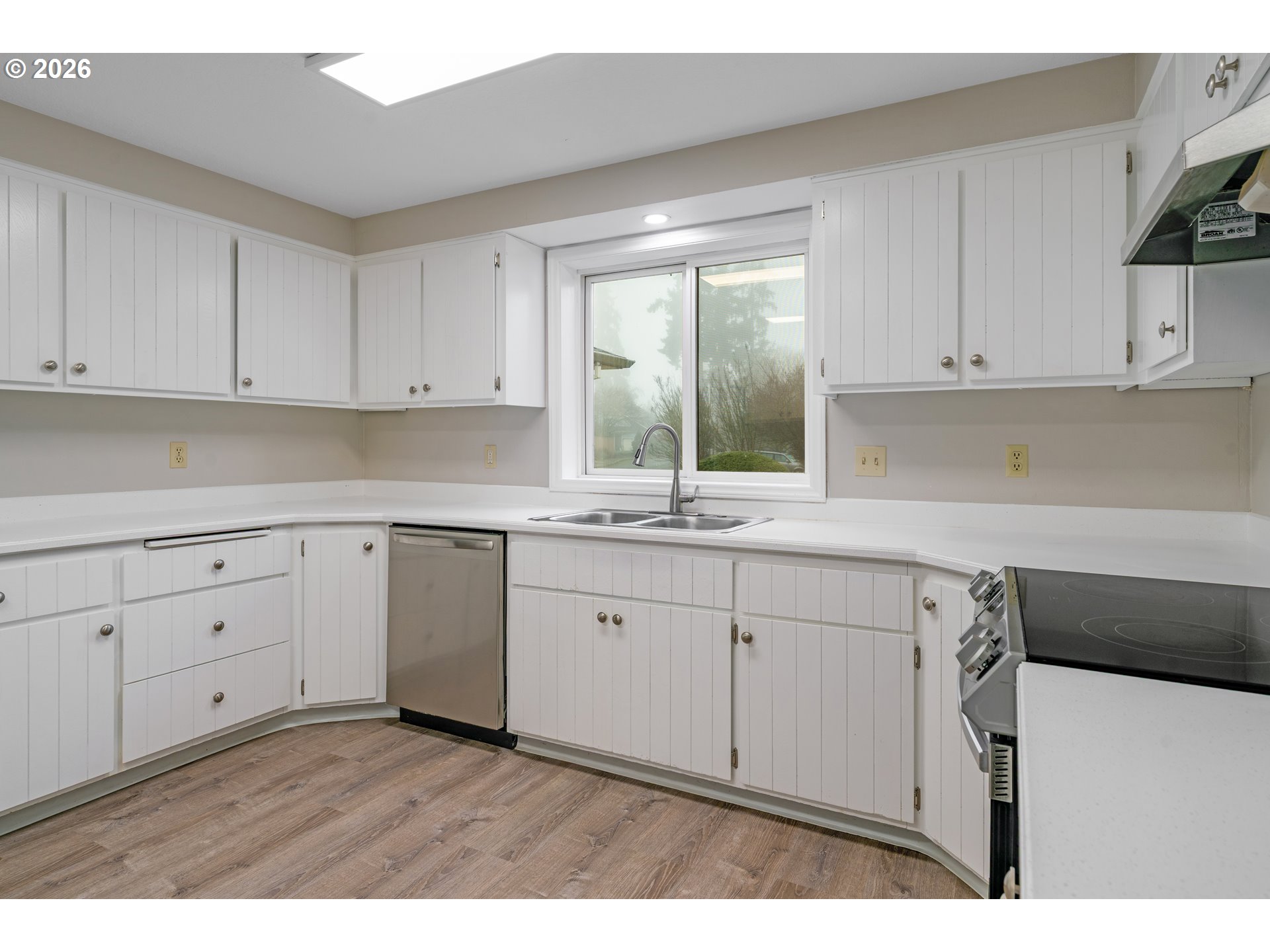 17839 Southwest Meadowbrook Way Beaverton, OR 97078 - Photo 11 of 45 a kitchen with white cabinets