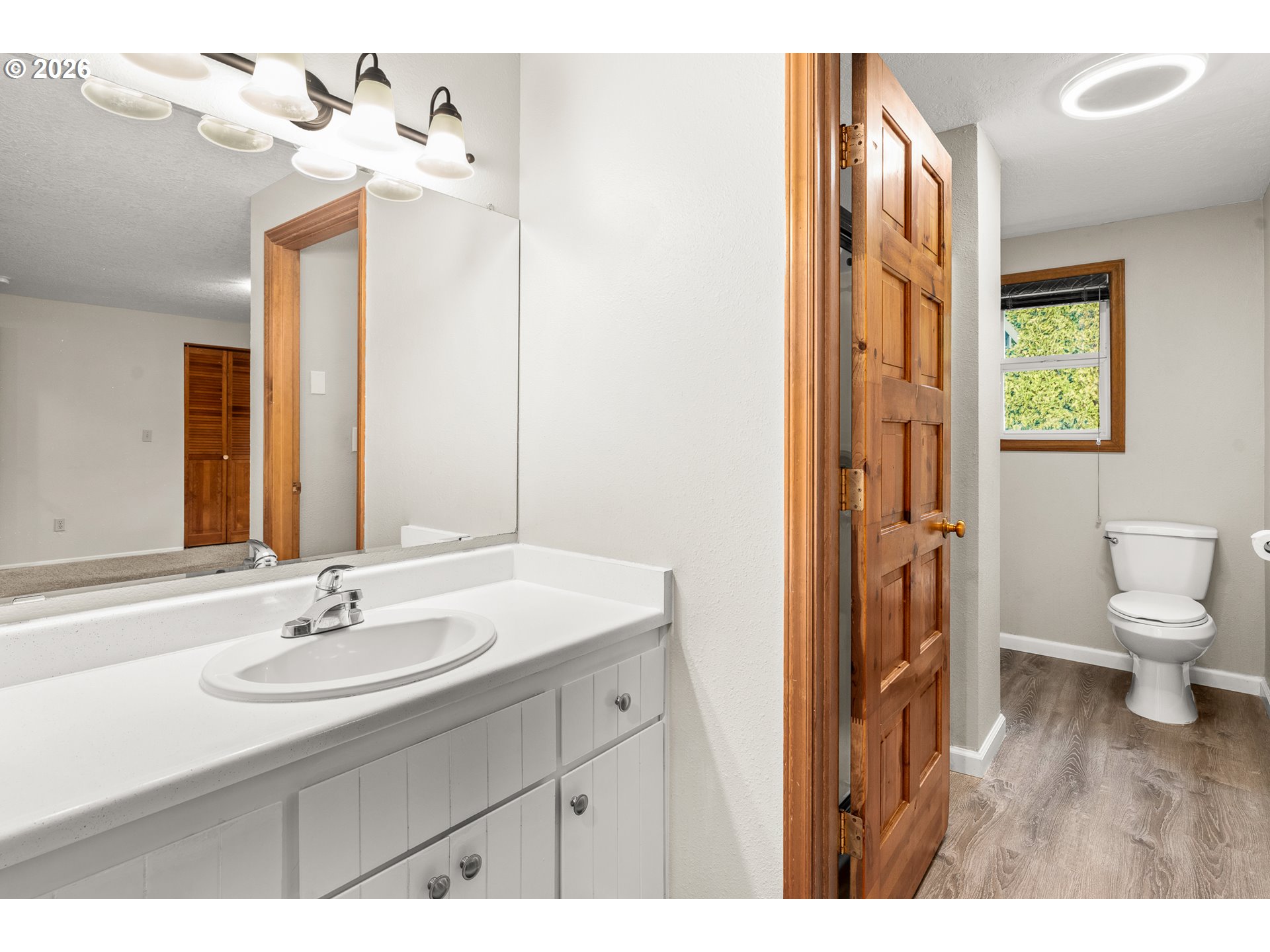 17839 Southwest Meadowbrook Way Beaverton, OR 97078 - Photo 15 of 45 a bathroom with a sink a toilet and a mirror