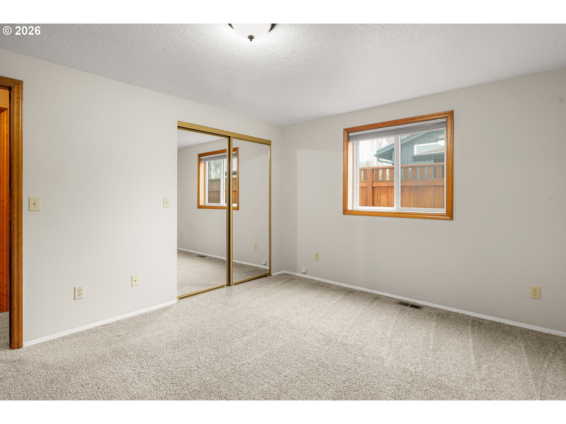 17839 Southwest Meadowbrook Way Beaverton, OR 97078 - Photo 18 of 45 a view of an empty room with a window