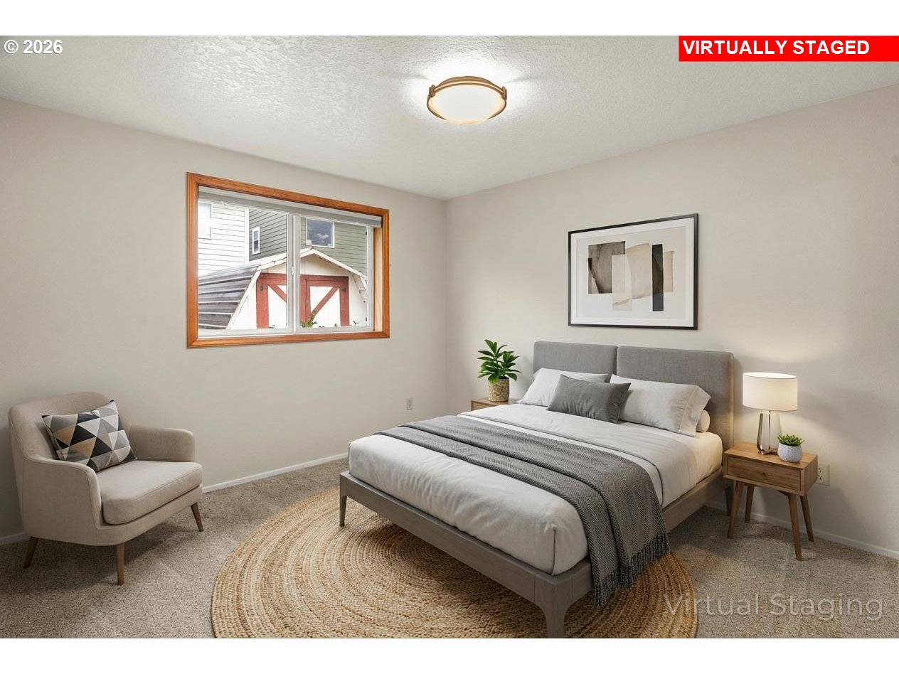 17839 Southwest Meadowbrook Way Beaverton, OR 97078 - Photo 19 of 45 a bedroom with a bed and a couch