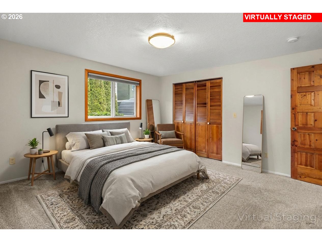 17839 Southwest Meadowbrook Way Beaverton, OR 97078 - Photo 23 of 45 a bedroom with a bed and a lamp