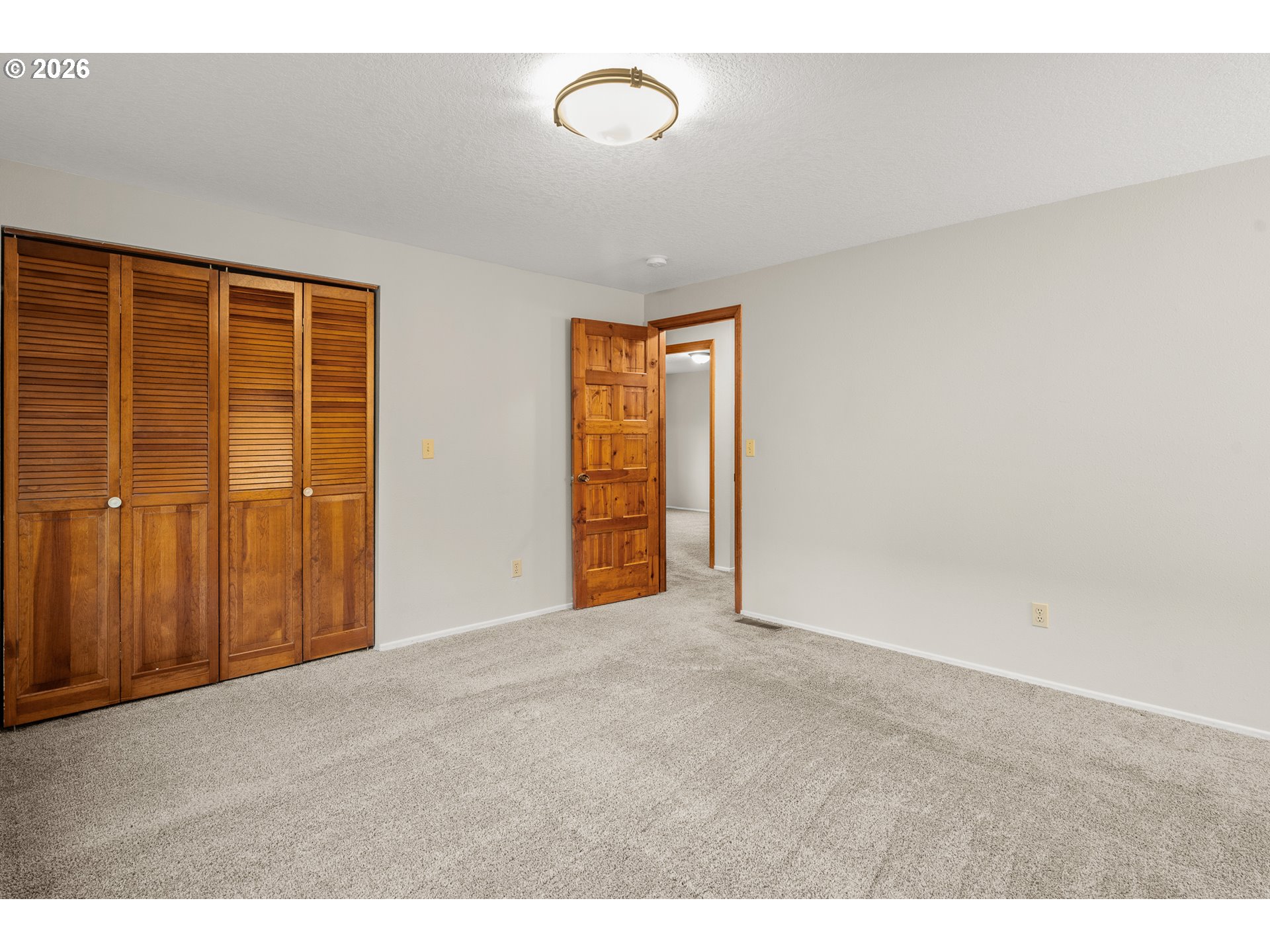 17839 Southwest Meadowbrook Way Beaverton, OR 97078 - Photo 24 of 45 a view of an empty room with wooden floor