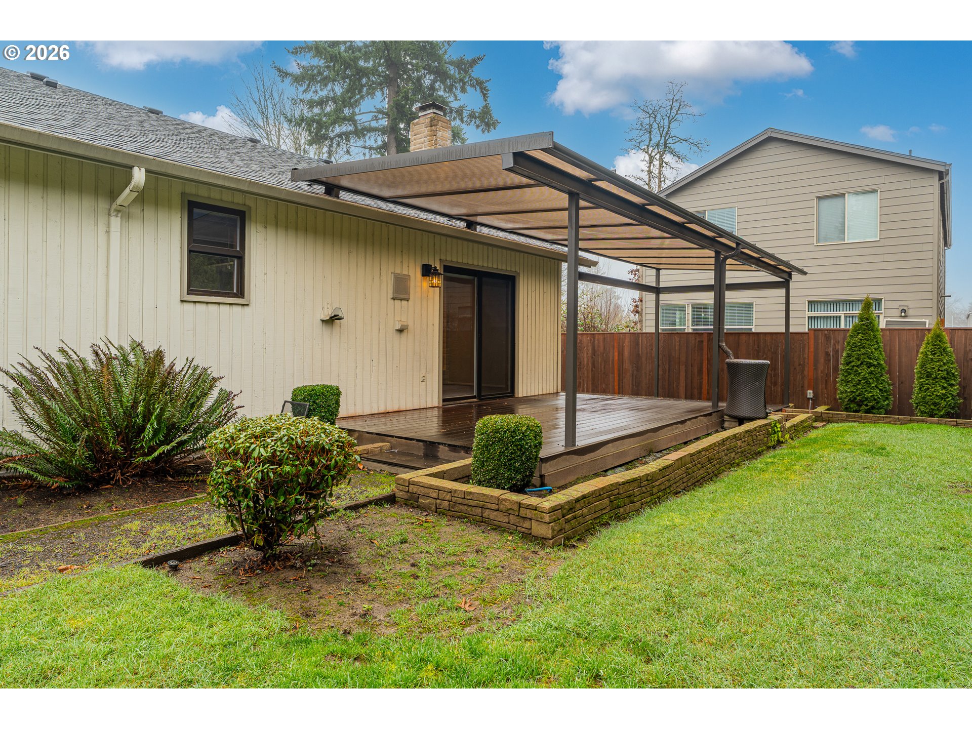 17839 Southwest Meadowbrook Way Beaverton, OR 97078 - Photo 35 of 45 a backyard of a house with table and chairs