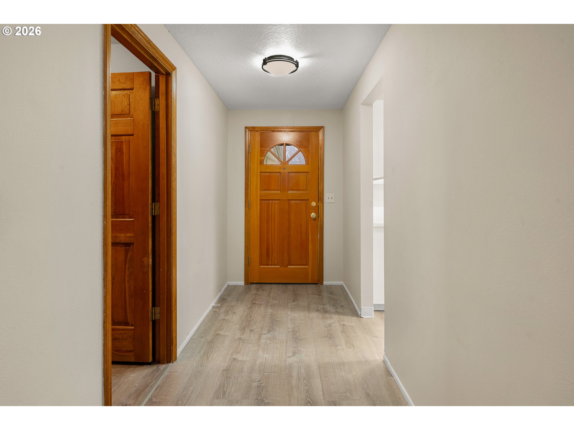 17839 Southwest Meadowbrook Way Beaverton, OR 97078 - Photo 4 of 45 a view of an empty room with wooden floor