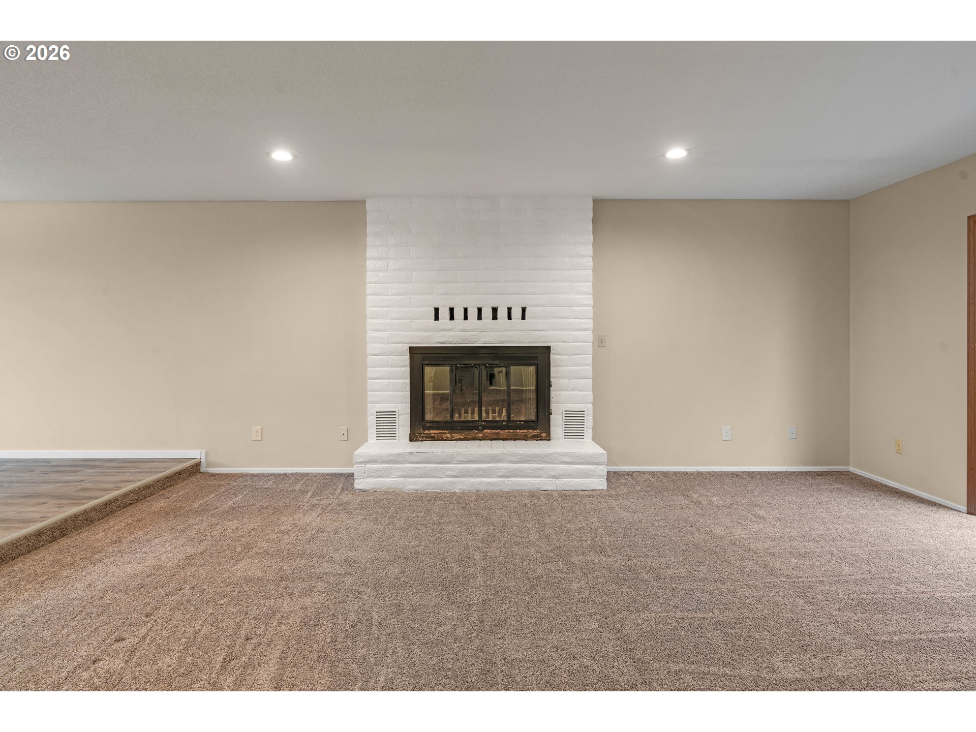 17839 Southwest Meadowbrook Way Beaverton, OR 97078 - Photo 6 of 45 a view of an empty room with a fireplace