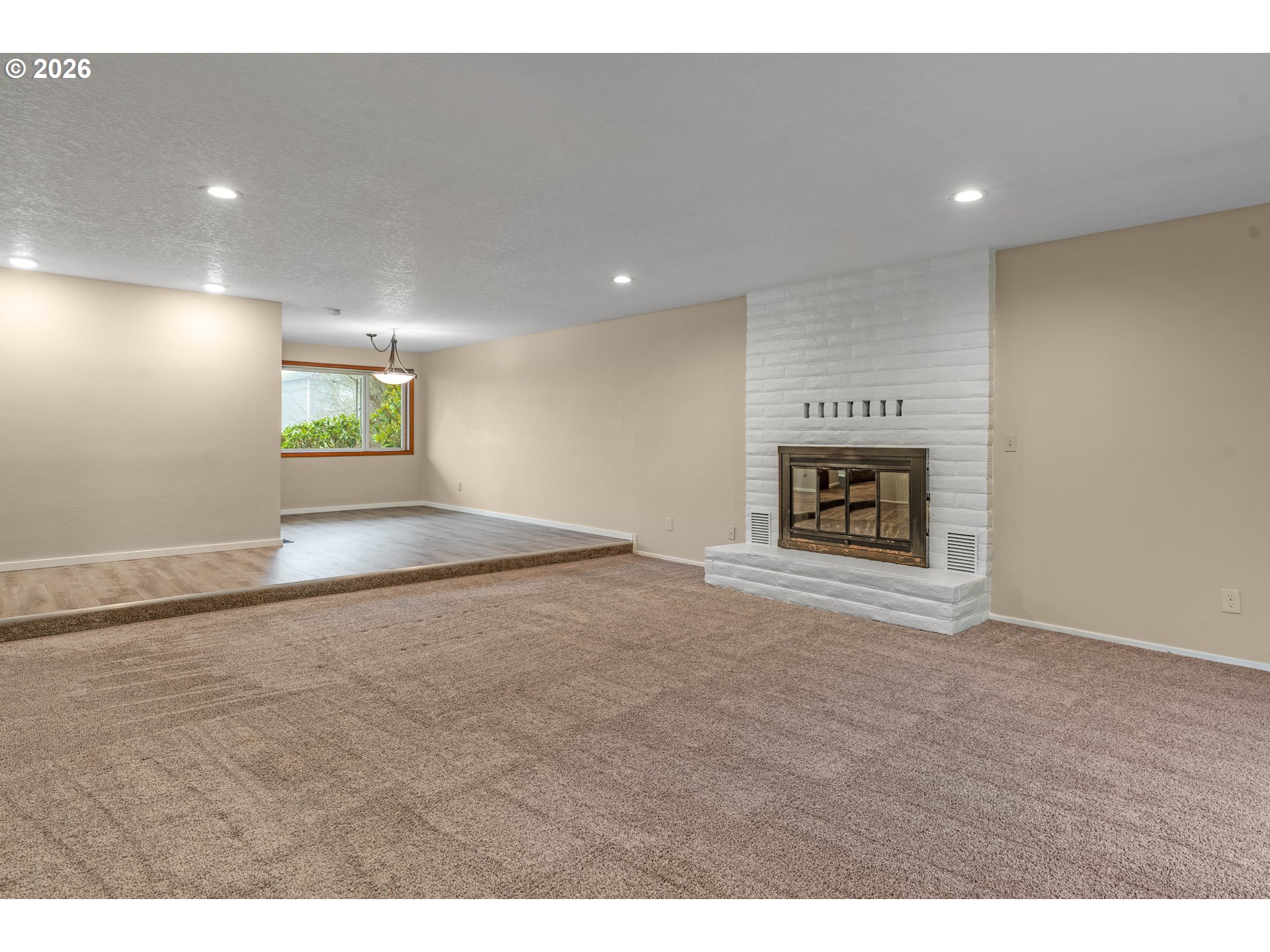 17839 Southwest Meadowbrook Way Beaverton, OR 97078 - Photo 7 of 45 a view of an empty room with a fireplace