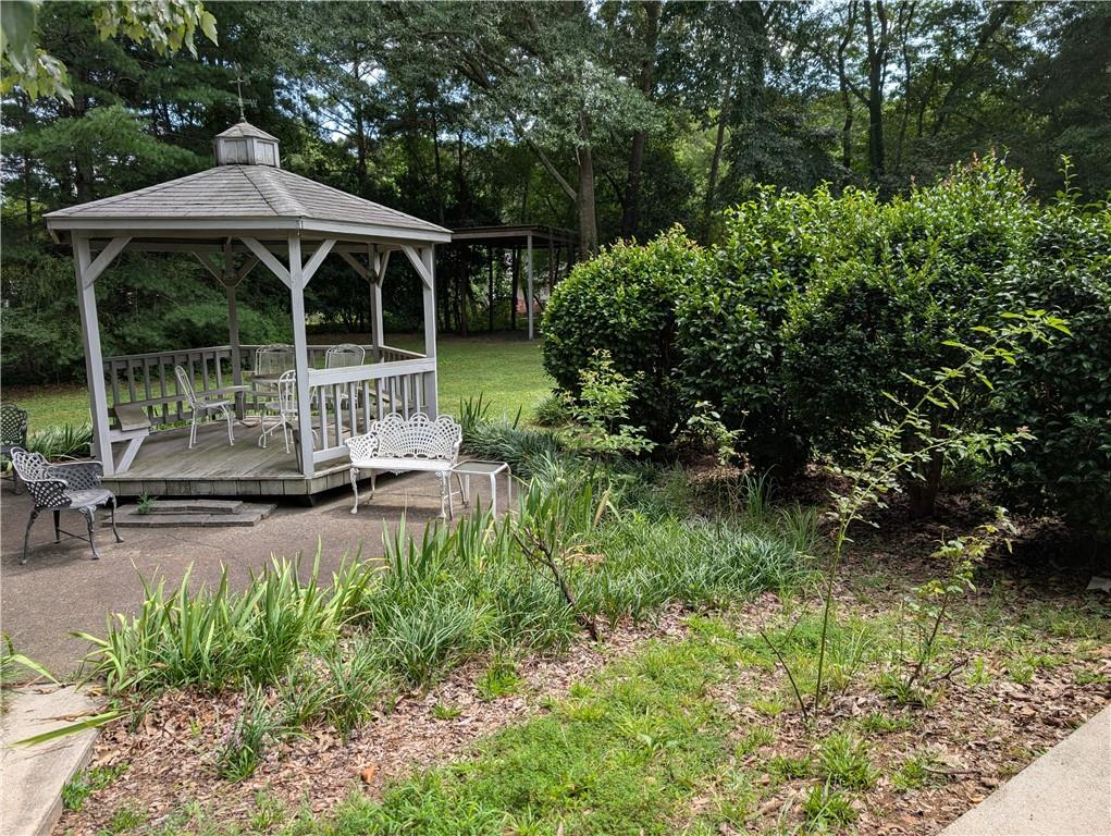 402 Pheasant Run Rome, GA 30161 - Photo 73 of 74 a view of a chair and table in backyard of the house