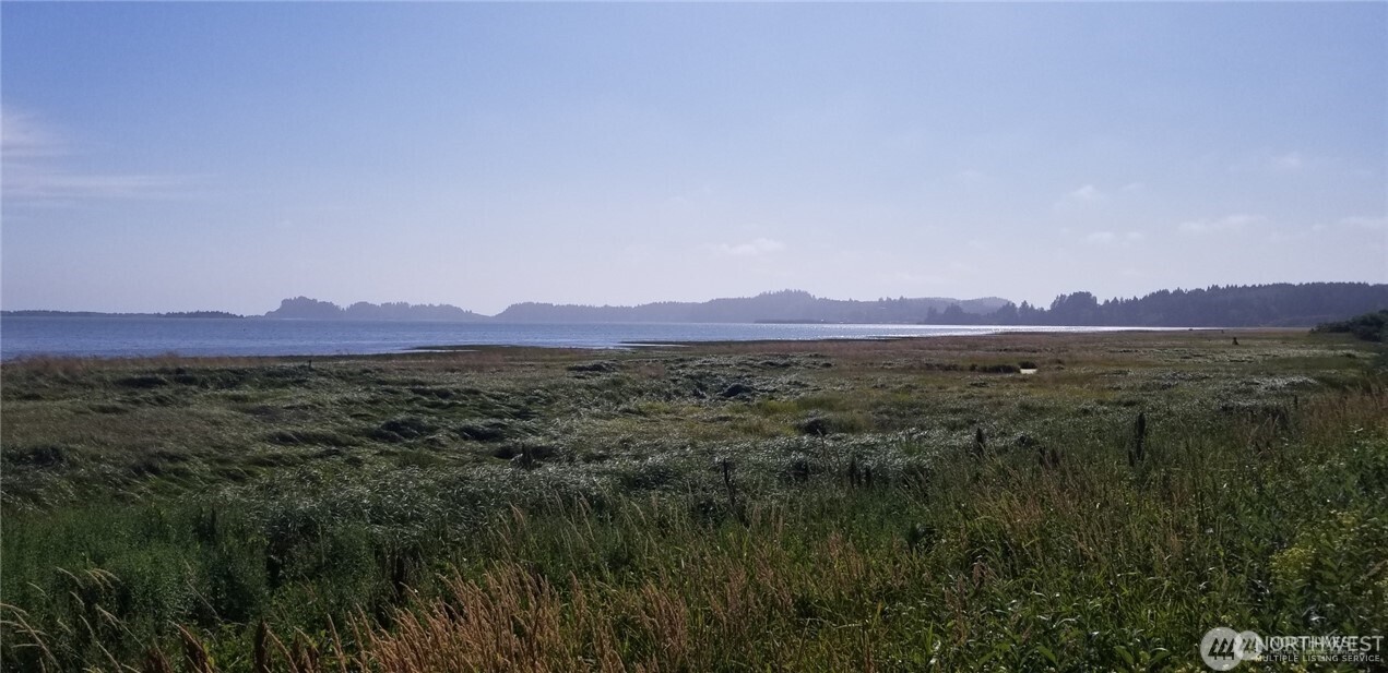 254 Stringtown Road, Unit UPPR Ilwaco, WA 98624 - Photo 6 of 7 a view of mountain and a lake view