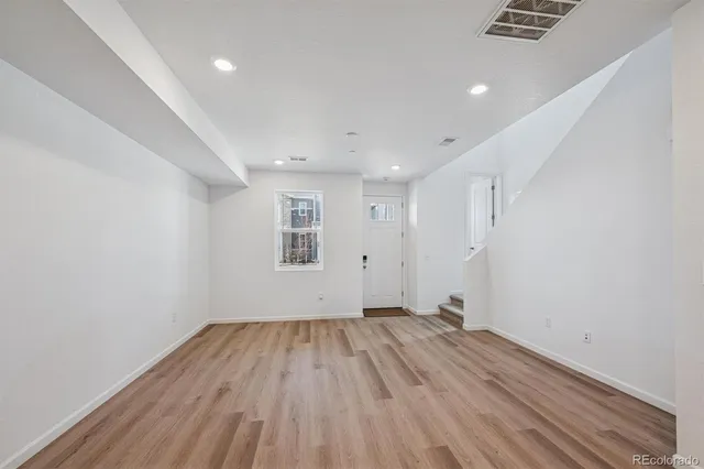 a view of room with wooden floor
