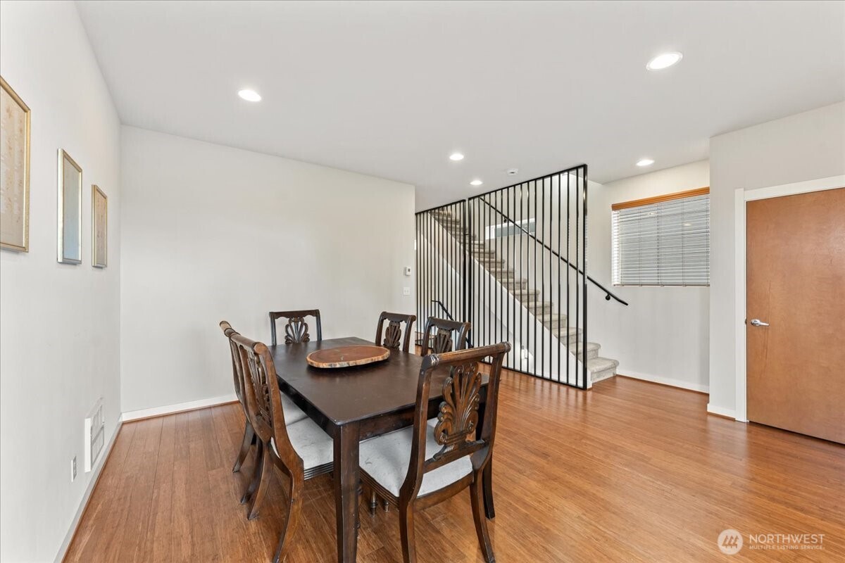 12418 2nd Place Southwest Burien, WA 98146 - Photo 9 of 39 a view of a dining room with furniture and wooden floor