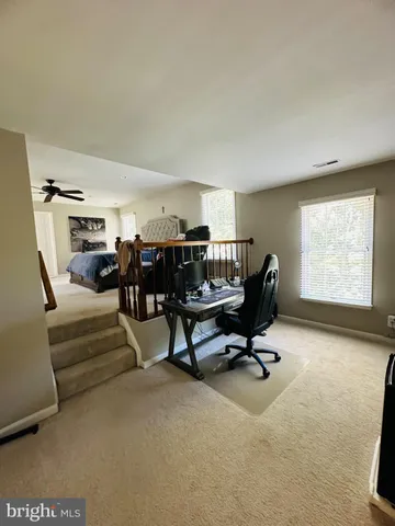 a spacious bedroom with a bed and window