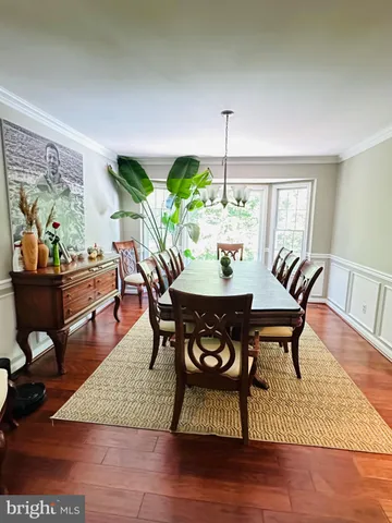 a kitchen with stainless steel appliances kitchen island granite countertop a refrigerator a stove top oven and a sink