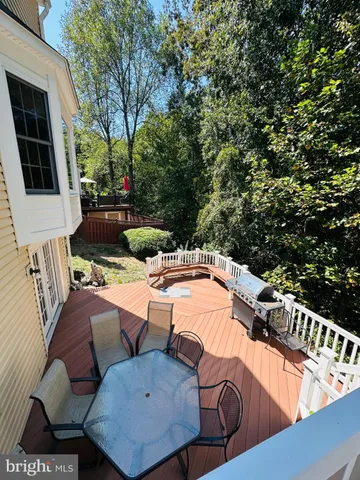 a view of a patio with a table and chairs