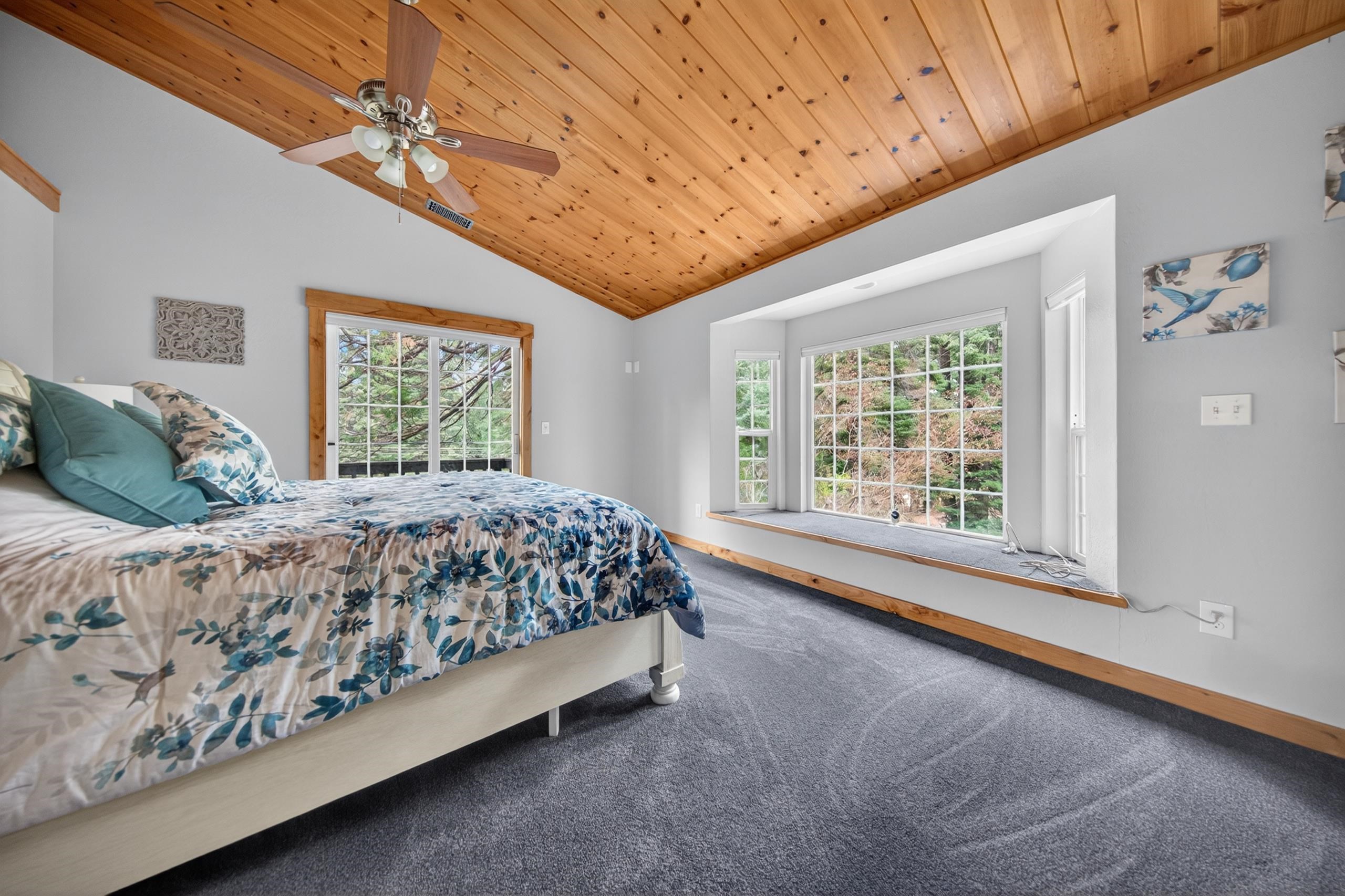 1220 Lynx Road Lake Almanor, CA 96137 - Photo 24 of 45 a bed sitting in a spacious bedroom next to a window