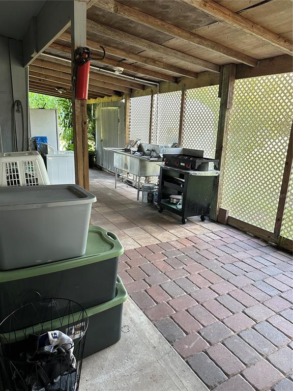 1326 Northeast Forrest Avenue Arcadia, FL 34266 - Photo 16 of 26 a living room with a couch and a table