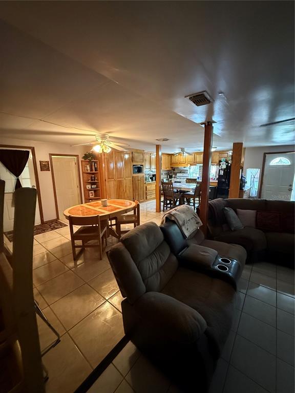 1326 Northeast Forrest Avenue Arcadia, FL 34266 - Photo 4 of 26 a living room with furniture and a lamp