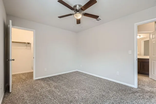 an empty room that has a window in it