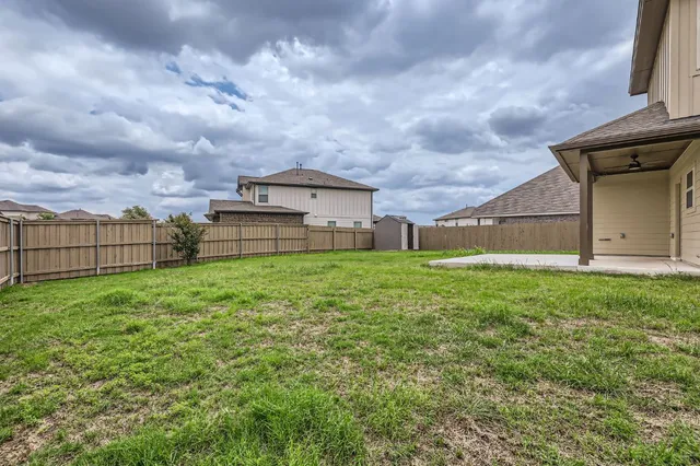 a view of a house with a back yard