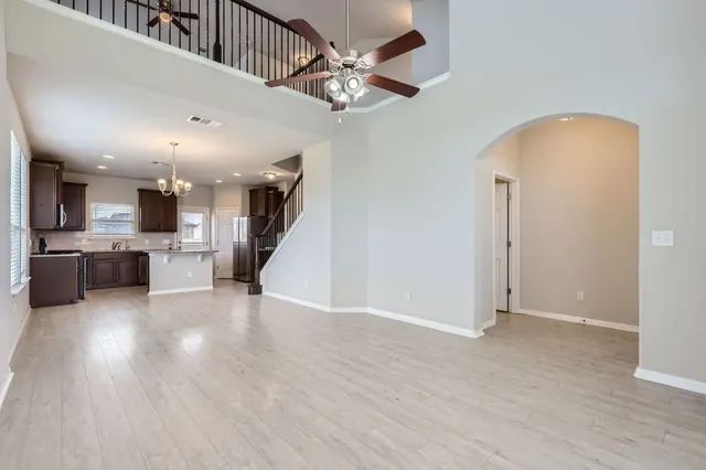 a view of kitchen with cabinets and wooden floor