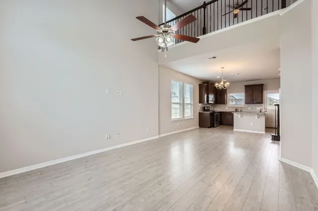 a view of kitchen with cabinets and wooden floor