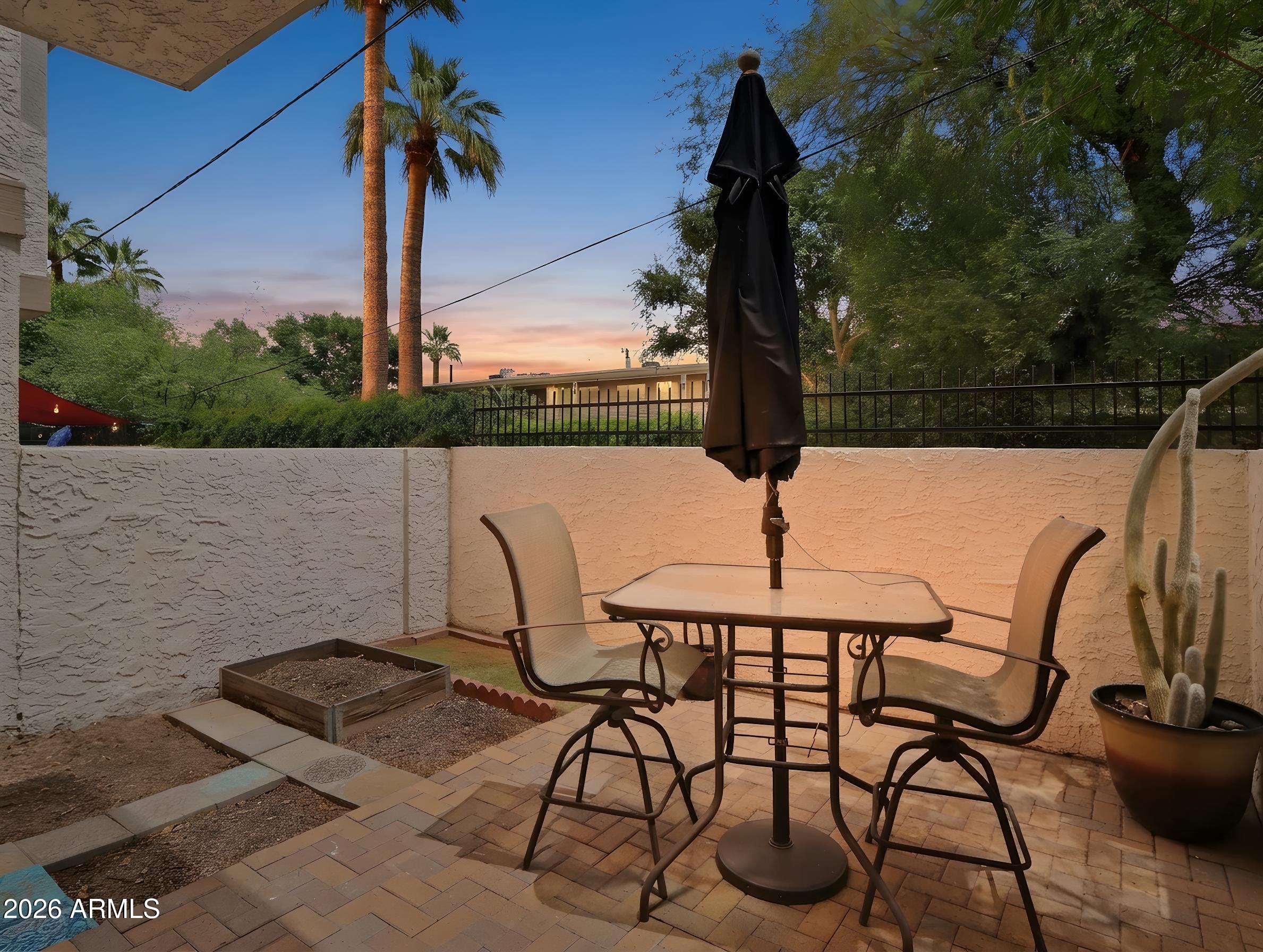 1402 East Osborn Road, Unit 2 Phoenix, AZ 85014 - Photo 25 of 29 a view of a terrace with furniture and stove