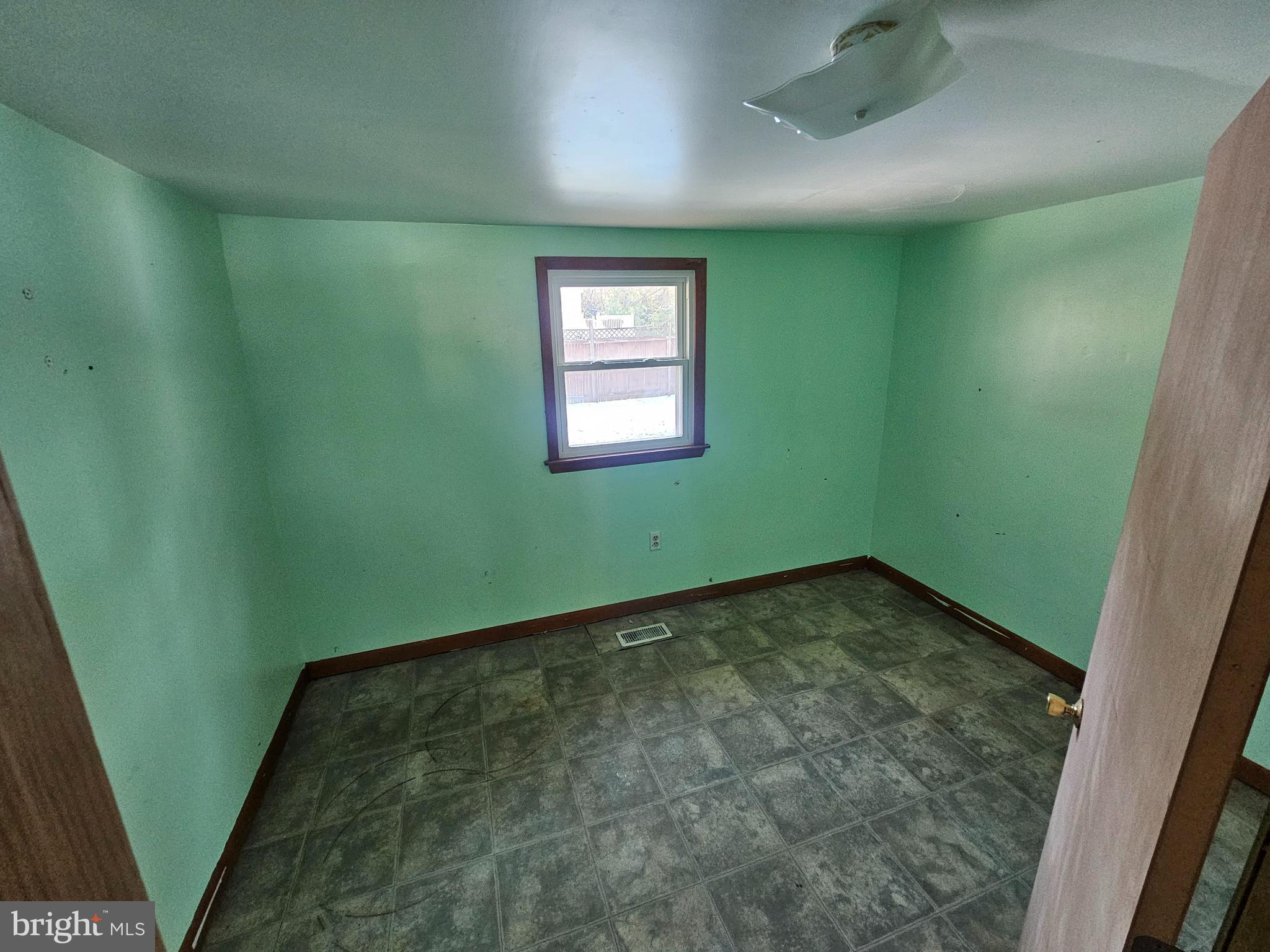 1915 Arundel Road Pasadena, MD 21122 - Photo 13 of 16 a view of a room with window and stairs