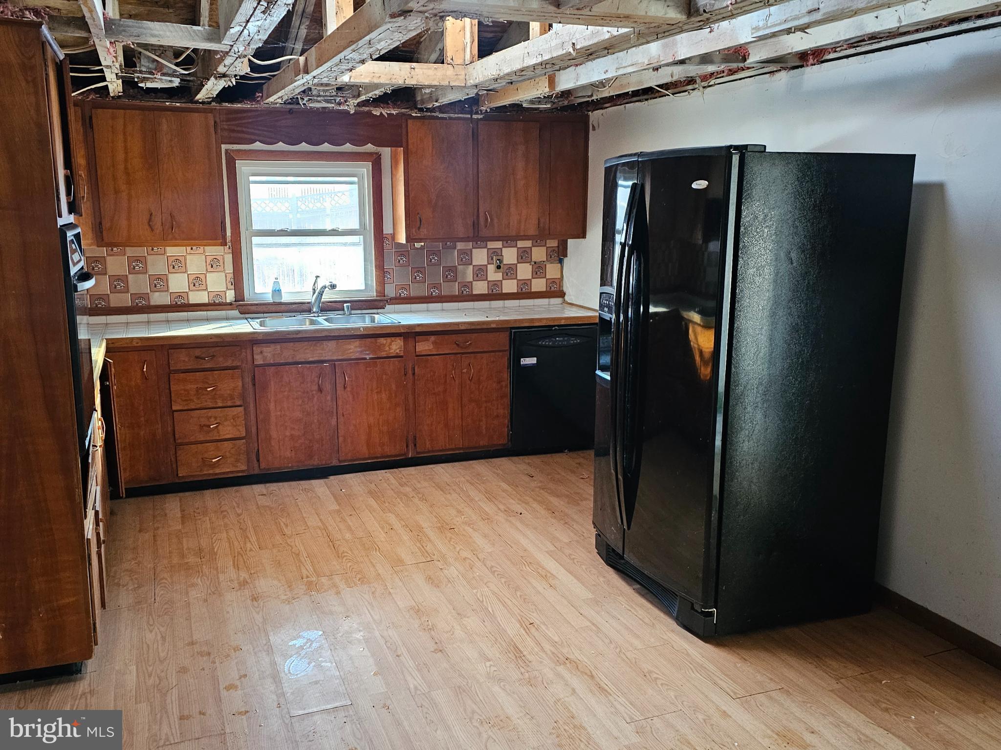 1915 Arundel Road Pasadena, MD 21122 - Photo 5 of 16 a kitchen with stainless steel appliances granite countertop a refrigerator and a stove