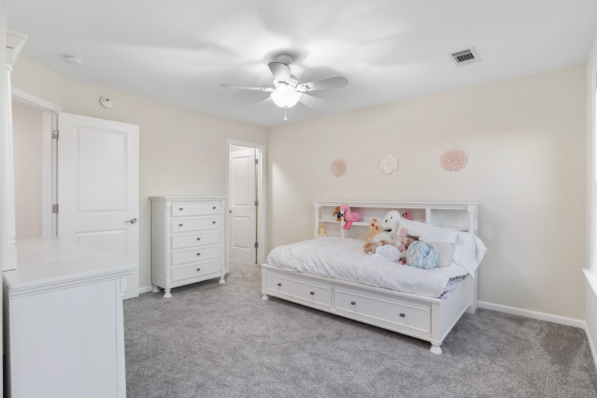 791 French River Road Nolensville, TN 37135 - Photo 17 of 48 a bedroom with a bed and a chandelier
