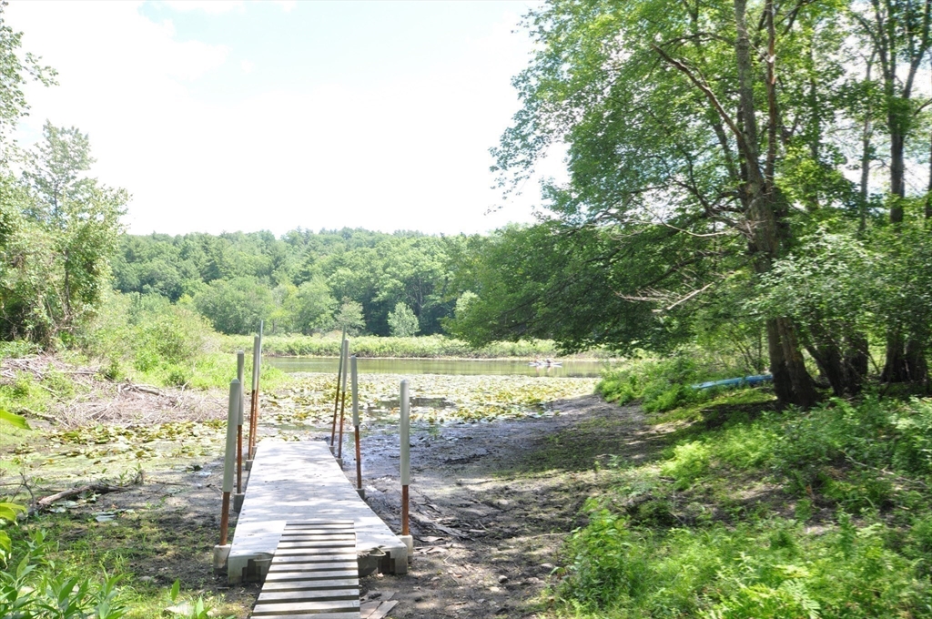 136 Holden Wood Road Concord, MA 01742 - Photo 25 of 31 a view of a lake with a yard
