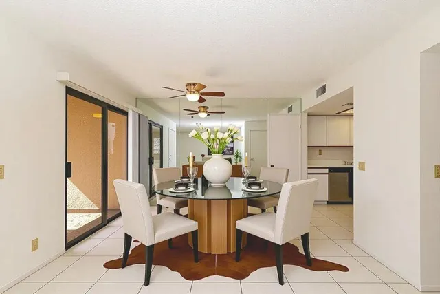 a kitchen with stainless steel appliances a refrigerator and cabinets
