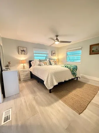 a bedroom with a bed and a couch