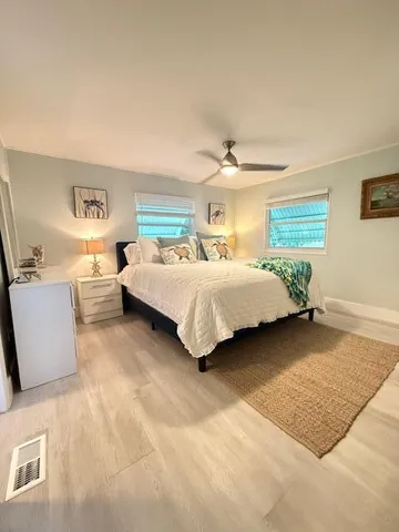 a bedroom with a bed and a couch