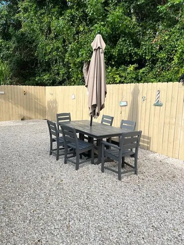 an outdoor sitting area with furniture