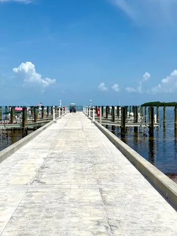 a view of swimming pool with outdoor seating