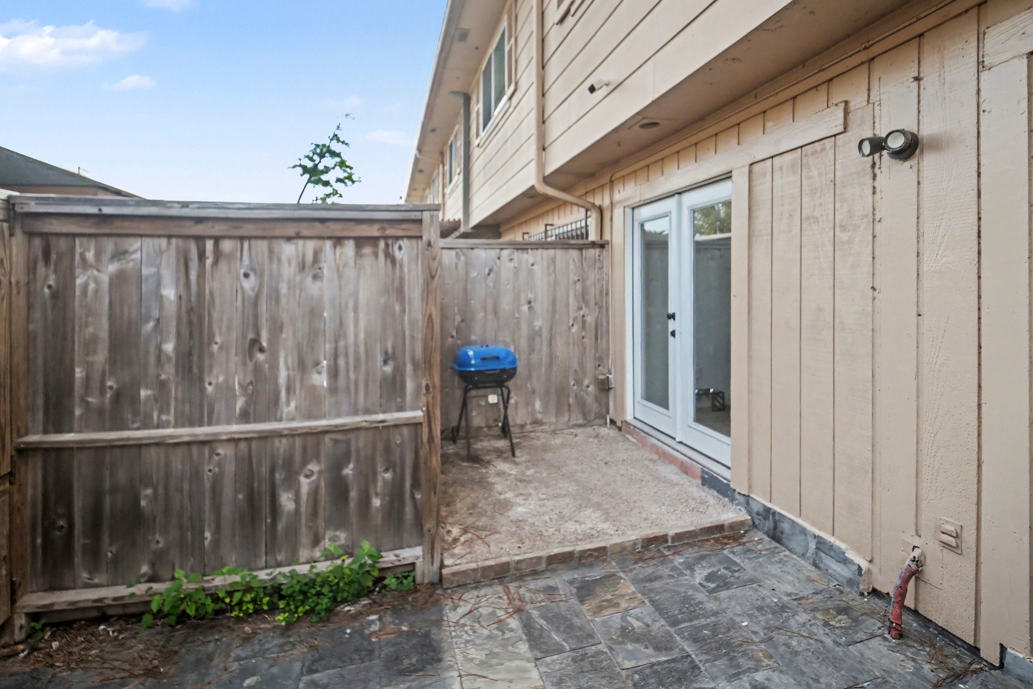 5801 Lumberdale Road, Unit 78 Houston, TX 77092 - Photo 31 of 35 Discover a charming private patio perfect for intimate gatherings, seamlessly blending cozy outdoor living with privacy and style.