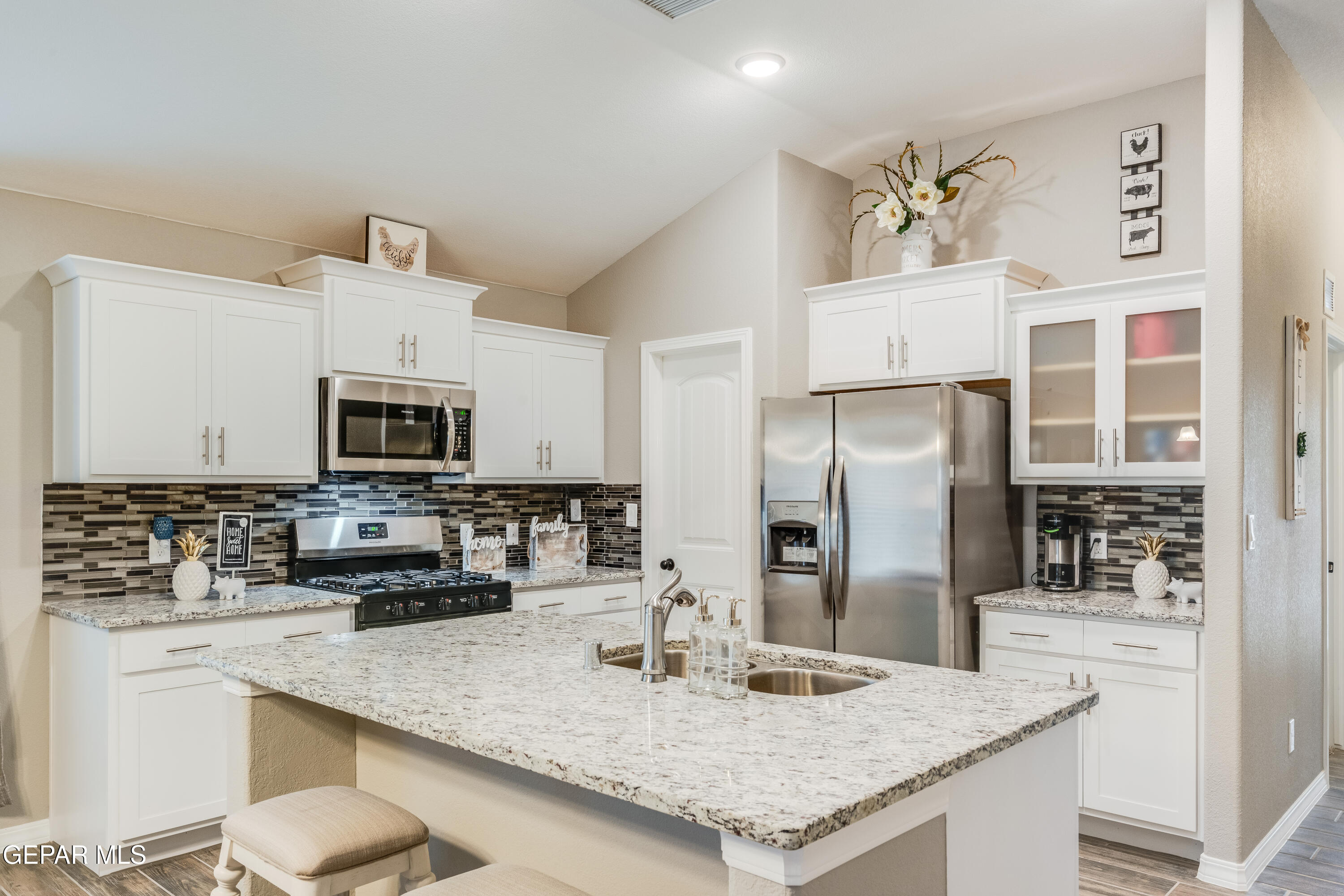 512 Caddo Lane Clint, TX 79836 - Photo 15 of 38 a kitchen with stainless steel appliances granite countertop a sink stove and refrigerator