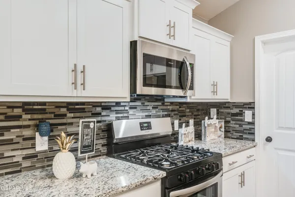 a kitchen with a stove and a sink