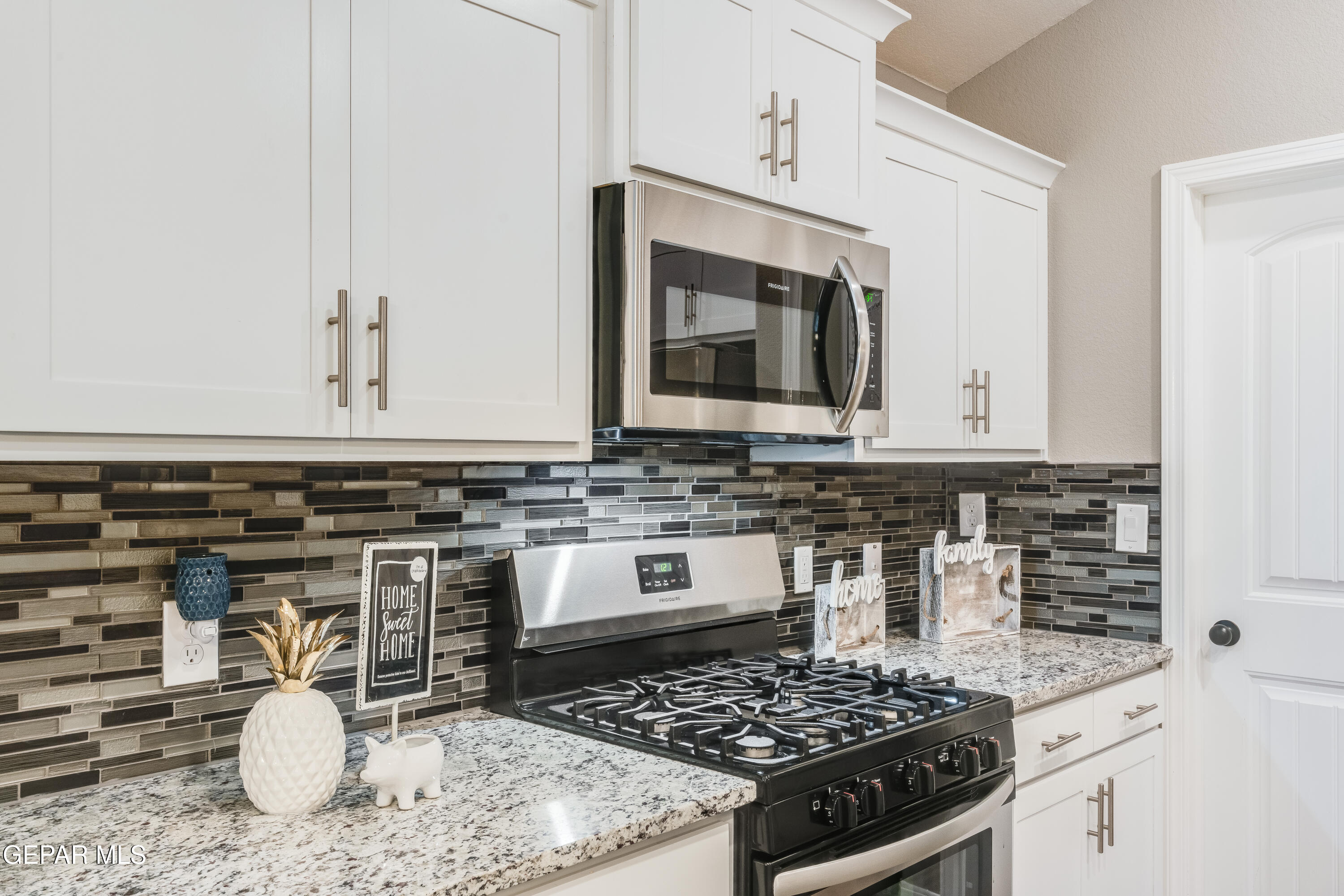 512 Caddo Lane Clint, TX 79836 - Photo 18 of 38 a kitchen with a stove and a sink