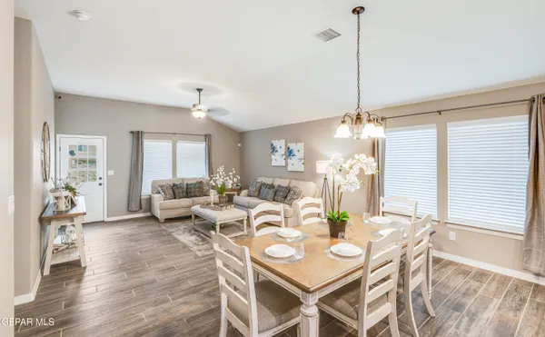 a view of a dining room with furniture window and wooden floor