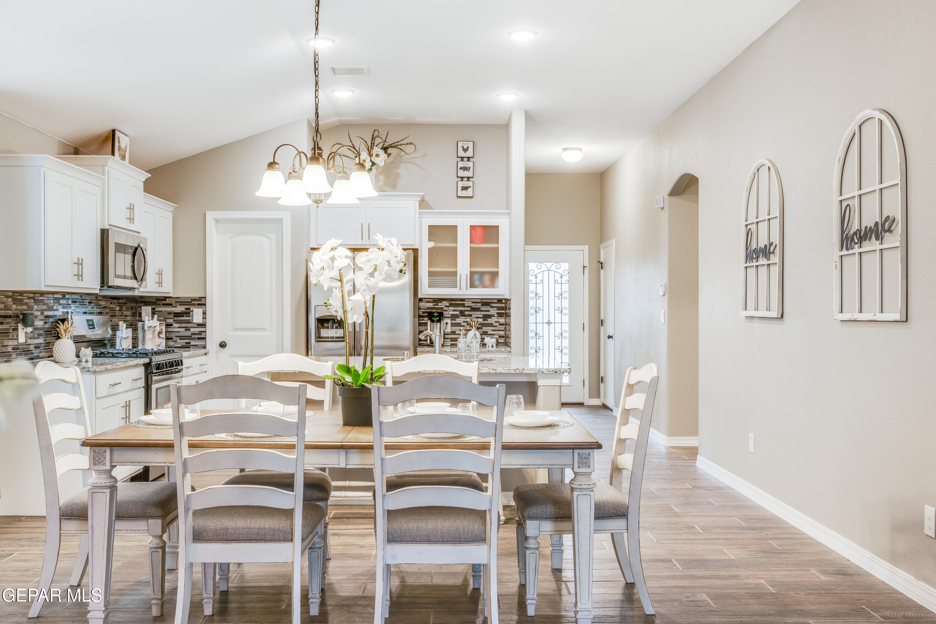 512 Caddo Lane Clint, TX 79836 - Photo 26 of 38 a view of a dining room with furniture and chandelier