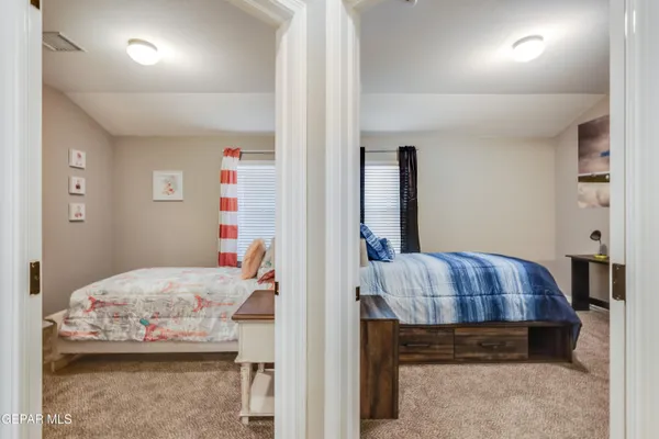 a bedroom with a bed and a dresser